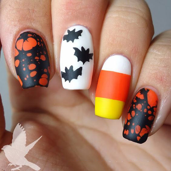 позитивный оранжевый рисунок на ногтях на Хэллоуин